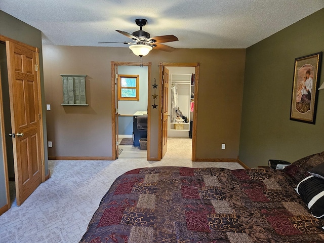 611 3rd St SW, Richville, MN 56576 - bedroom featuring light colored carpet, a textured ceiling, a ceiling fan, and ensuite bathroom