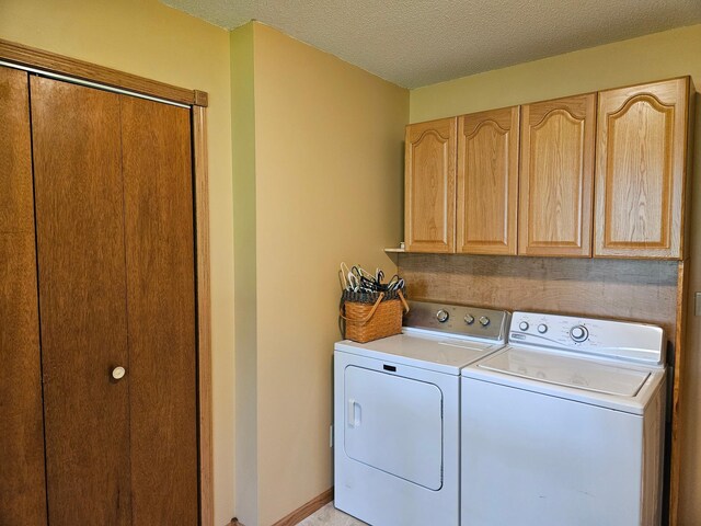 611 3rd St SW, Richville, MN 56576 - laundry area with cabinet space, independent washer and dryer, and a textured ceiling
