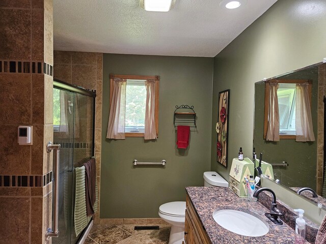 611 3rd St SW, Richville, MN 56576 - full bathroom featuring vanity, a shower stall, and a textured ceiling