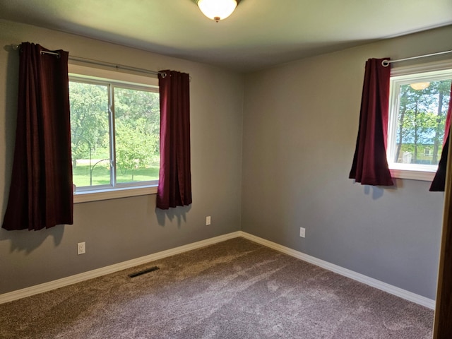 611 3rd St SW, Richville, MN 56576 - spare room with dark colored carpet and baseboards