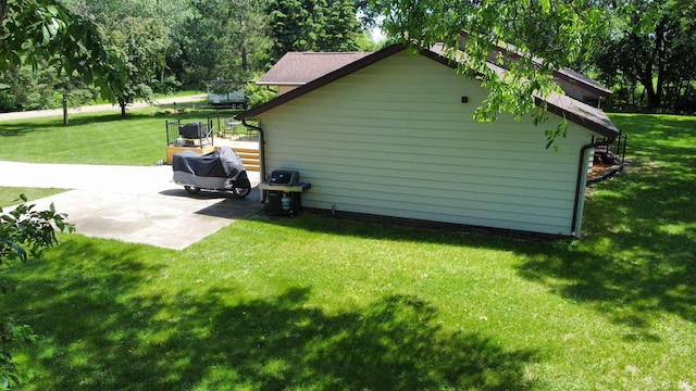 611 3rd St SW, Richville, MN 56576 - view of home's exterior with a lawn and a patio area