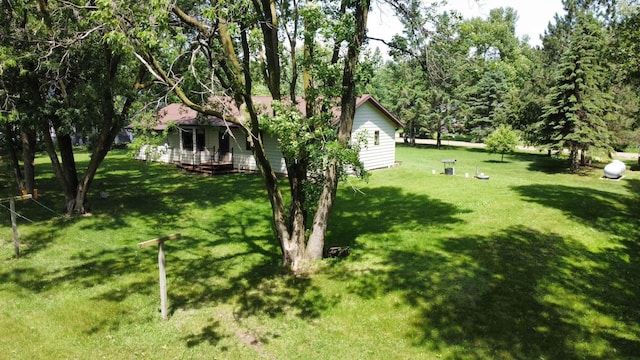 611 3rd St SW, Richville, MN 56576 - view of grassy yard with a porch