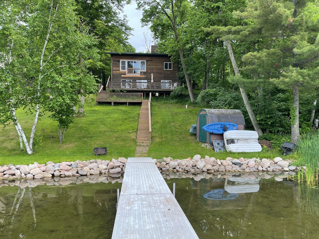 30883 Fish Trap Lake Dr, Cushing, MN 56443 - dock area with a yard and a wooden deck