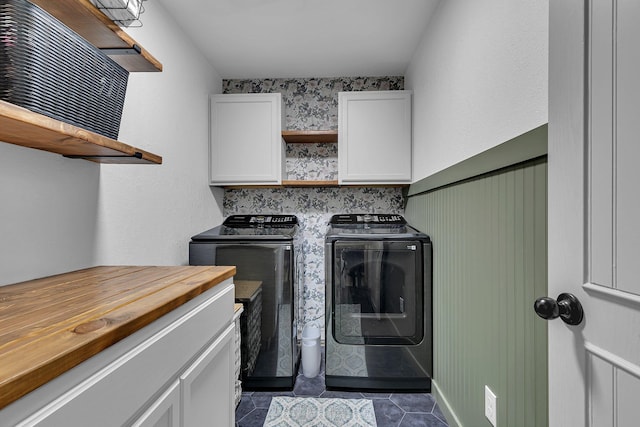 3773 County Road 74, Saint Cloud, MN 56301 - washroom featuring washer and clothes dryer, cabinet space, and dark tile patterned floors