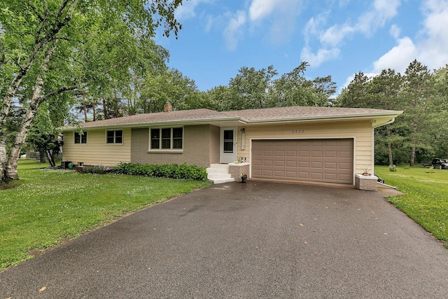 3773 County Road 74, Saint Cloud, MN 56301 - single story home featuring asphalt driveway, an attached garage, a front lawn, and a chimney