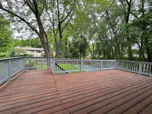 2360 3rd St NW, New Brighton, MN 55112 - deck featuring view of wooded area
