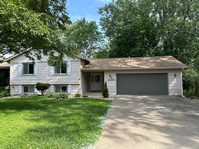2360 3rd St NW, New Brighton, MN 55112 - split level home with concrete driveway, a front lawn, and an attached garage