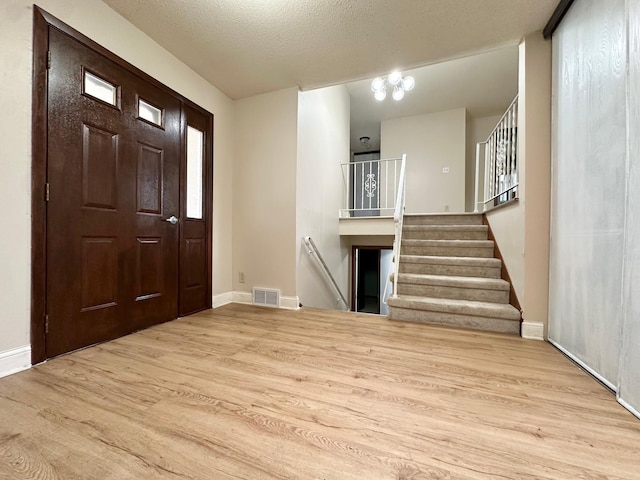 2360 3rd St NW, New Brighton, MN 55112 - entryway featuring wood finished floors and baseboards