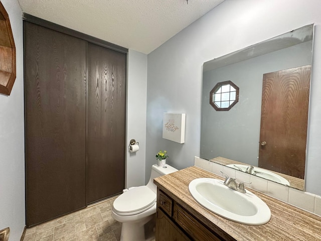 2360 3rd St NW, New Brighton, MN 55112 - half bathroom with vanity and a textured ceiling