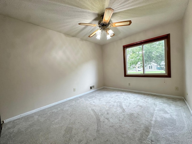 2360 3rd St NW, New Brighton, MN 55112 - unfurnished room featuring carpet floors, ceiling fan, and a textured ceiling