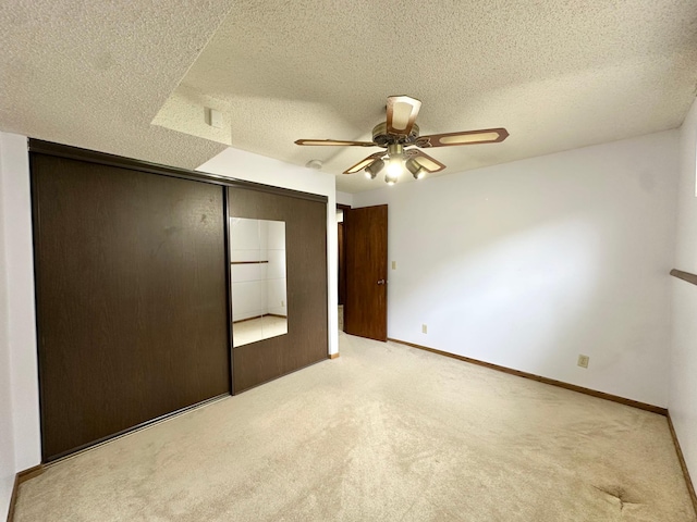 2360 3rd St NW, New Brighton, MN 55112 - unfurnished bedroom with carpet floors, a closet, a textured ceiling, and ceiling fan
