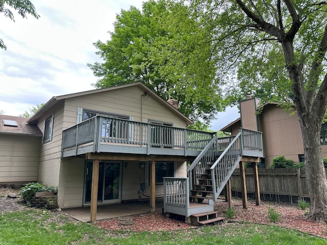 2360 3rd St NW, New Brighton, MN 55112 - back of property featuring stairway, a deck, a patio, and a chimney