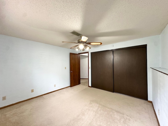 2360 3rd St NW, New Brighton, MN 55112 - unfurnished bedroom with light carpet, a closet, a textured ceiling, and a ceiling fan