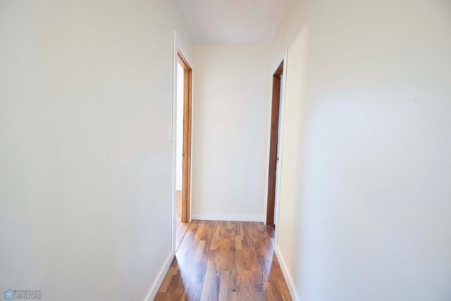405 18th St N, Moorhead, MN 56560 - hallway featuring wood finished floors and baseboards