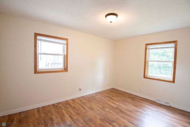 405 18th St N, Moorhead, MN 56560 - spare room with wood finished floors