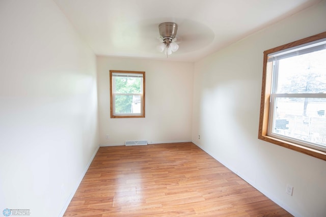 405 18th St N, Moorhead, MN 56560 - empty room with ceiling fan and light wood-style floors