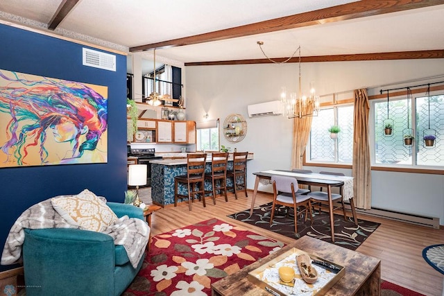 722 Elm St N Unit A8, Fargo, ND 58102 - living area with a chandelier, a wall unit AC, and wood finished floors