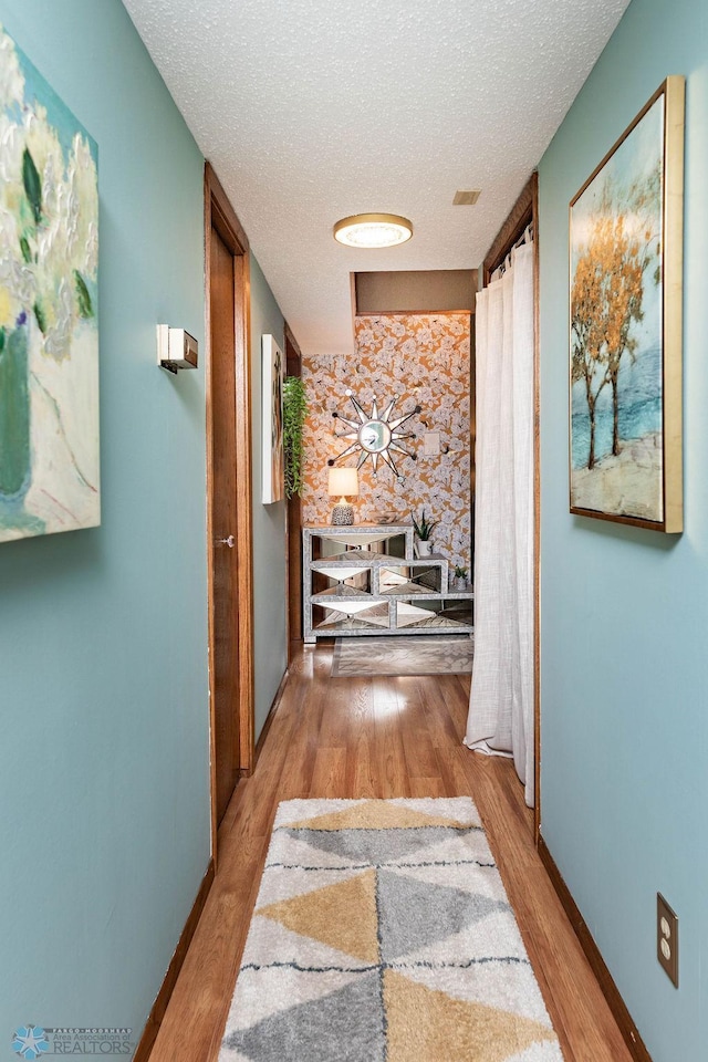 722 Elm St N Unit A8, Fargo, ND 58102 - hallway with a textured ceiling and wood finished floors