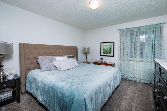 722 Elm St N Unit A8, Fargo, ND 58102 - bedroom with dark carpet and a textured ceiling