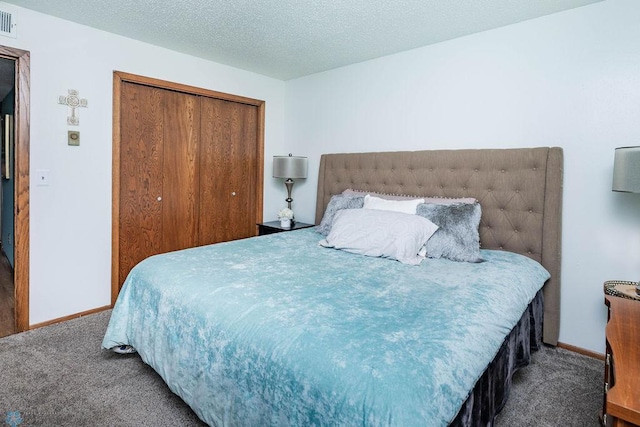 722 Elm St N Unit A8, Fargo, ND 58102 - carpeted bedroom featuring a closet and a textured ceiling