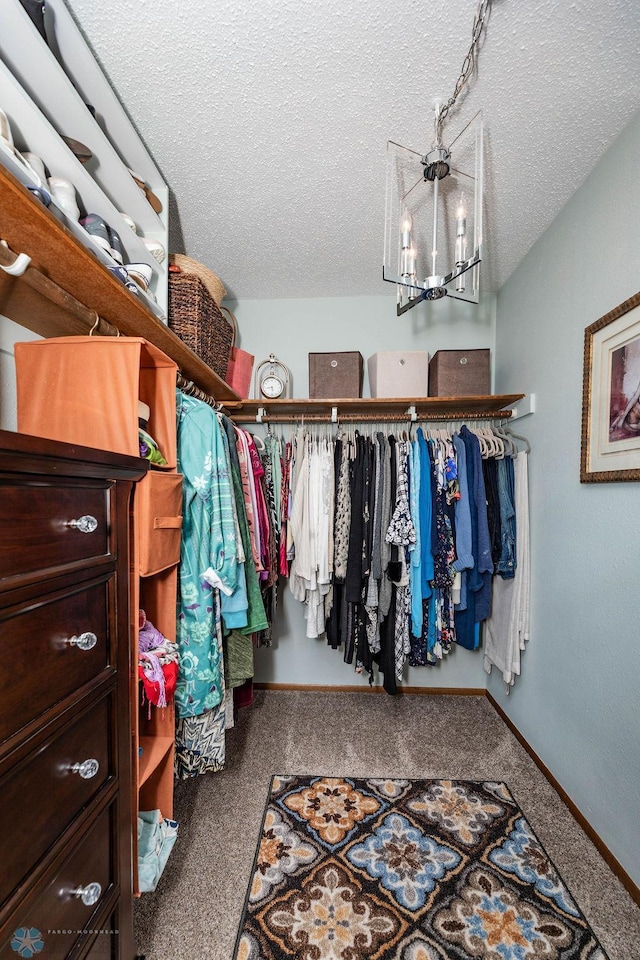 722 Elm St N Unit A8, Fargo, ND 58102 - spacious closet featuring a chandelier and carpet floors