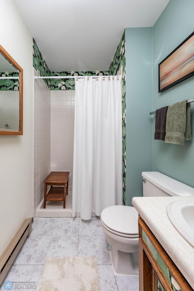 722 Elm St N Unit A8, Fargo, ND 58102 - bathroom with baseboard heating, tiled shower, and vanity