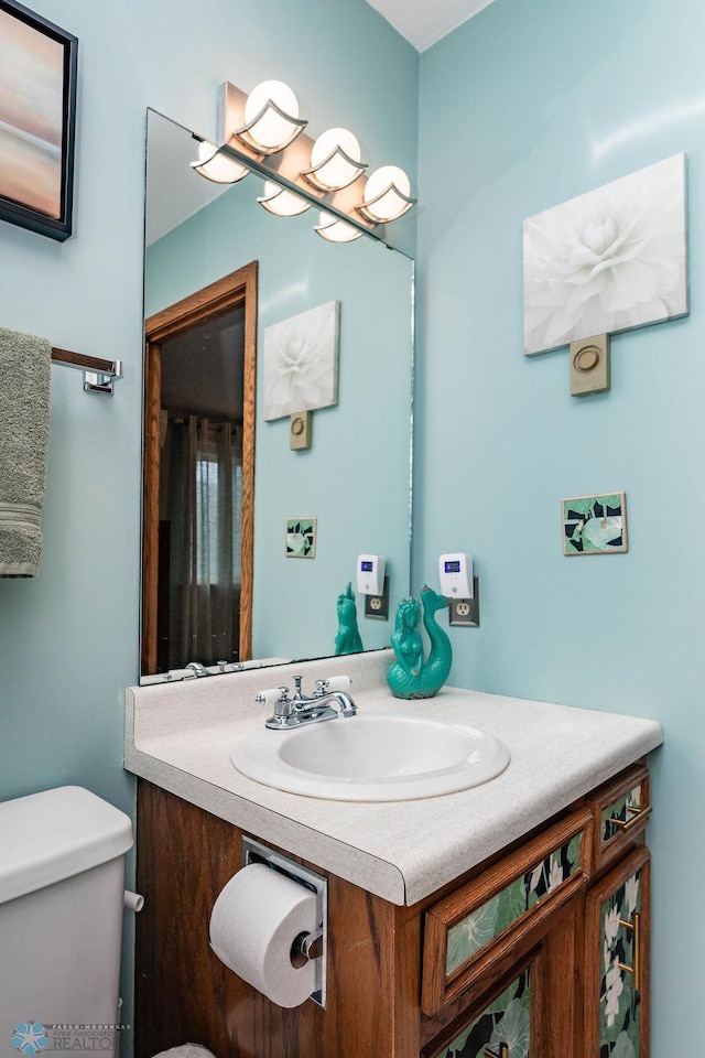 722 Elm St N Unit A8, Fargo, ND 58102 - bathroom featuring vanity and toilet
