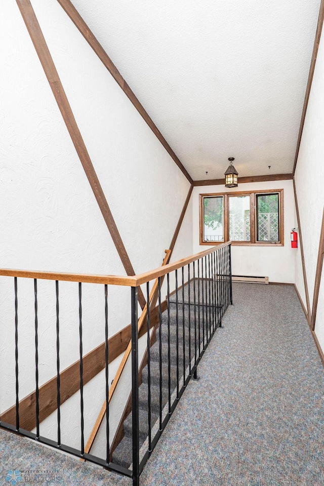 722 Elm St N Unit A8, Fargo, ND 58102 - stairs featuring carpet, a baseboard radiator, and crown molding
