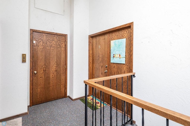 722 Elm St N Unit A8, Fargo, ND 58102 - hallway with carpet flooring, an upstairs landing, and a textured wall