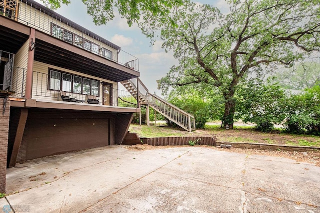 722 Elm St N Unit A8, Fargo, ND 58102 - view of patio featuring stairs and concrete driveway