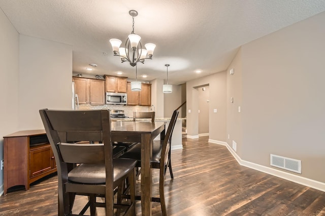 9902 5th Street Ln N, Lake Elmo, MN 55042 - dining space with a chandelier, dark wood finished floors, and recessed lighting