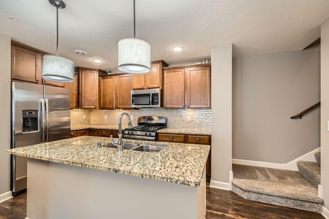 9902 5th Street Ln N, Lake Elmo, MN 55042 - kitchen with appliances with stainless steel finishes, brown cabinets, dark wood-type flooring, light stone counters, and recessed lighting
