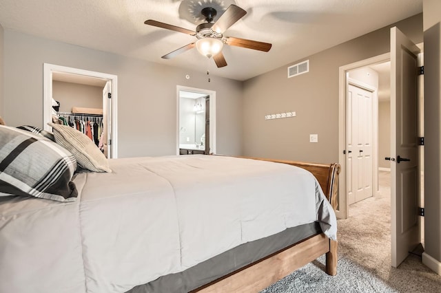 9902 5th Street Ln N, Lake Elmo, MN 55042 - bedroom featuring carpet flooring, a walk in closet, ceiling fan, and a closet