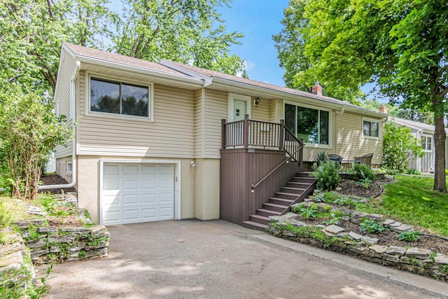 1007 Ingerson Rd, Shoreview, MN 55126 - ranch-style house with a garage, asphalt driveway, a chimney, and stairs