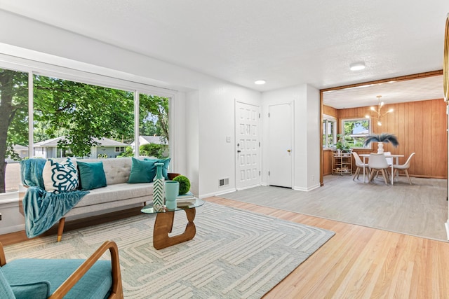 1007 Ingerson Rd, Shoreview, MN 55126 - living room featuring wood finished floors and a chandelier