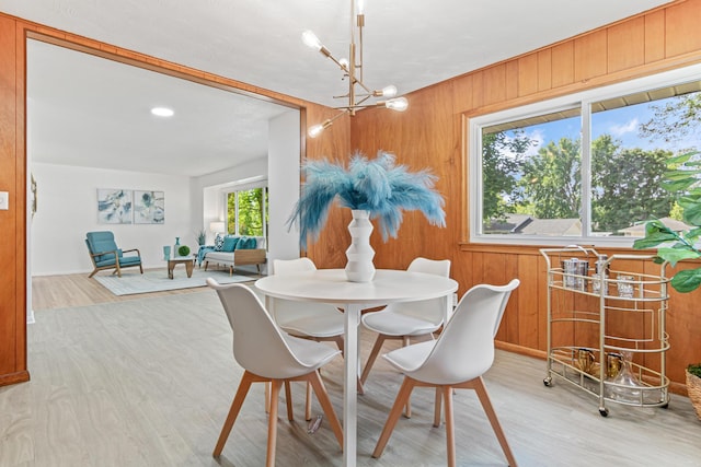 1007 Ingerson Rd, Shoreview, MN 55126 - dining area with light wood-style floors, wood walls, a chandelier, and recessed lighting