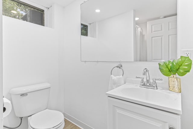 1007 Ingerson Rd, Shoreview, MN 55126 - full bathroom with vanity, recessed lighting, and wood finished floors