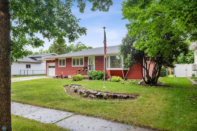 2319 10th St S, Fargo, ND 58103 - view of front facade featuring an attached garage, driveway, and a gate