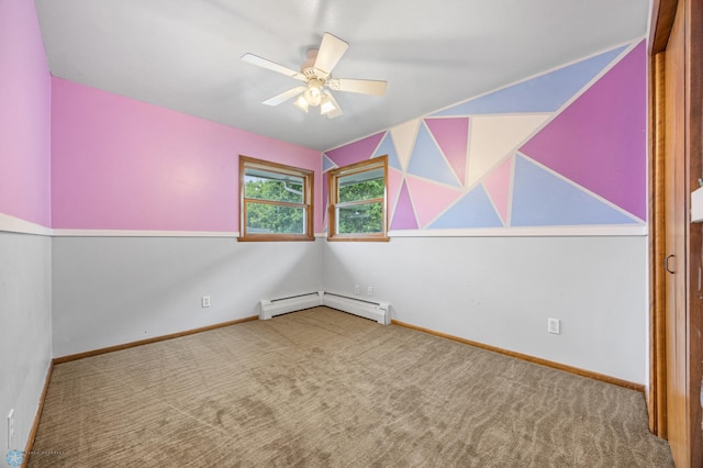 2319 10th St S, Fargo, ND 58103 - unfurnished room featuring baseboard heating, carpet, and a ceiling fan