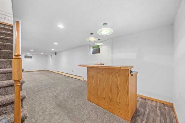 2319 10th St S, Fargo, ND 58103 - indoor wet bar with a baseboard heating unit, stairs, recessed lighting, and decorative light fixtures