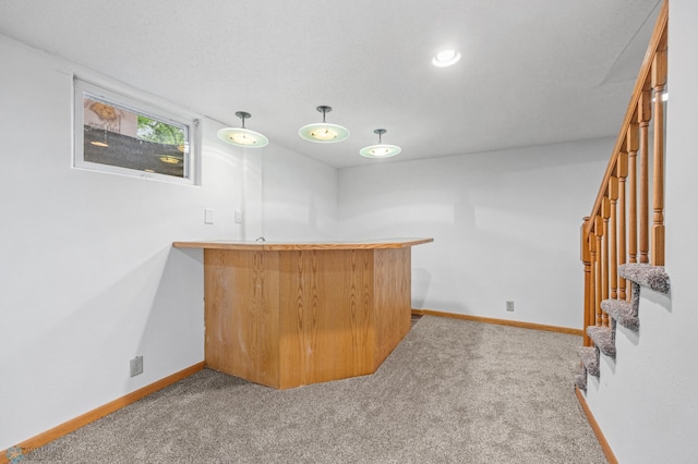 2319 10th St S, Fargo, ND 58103 - indoor wet bar with stairs, carpet floors, and decorative light fixtures