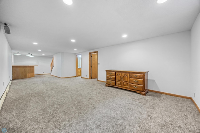 2319 10th St S, Fargo, ND 58103 - finished basement with recessed lighting, light carpet, and bar