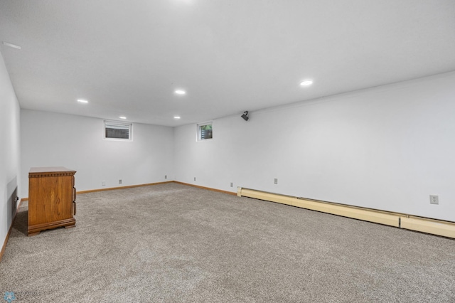 2319 10th St S, Fargo, ND 58103 - basement featuring a baseboard heating unit, carpet flooring, and recessed lighting