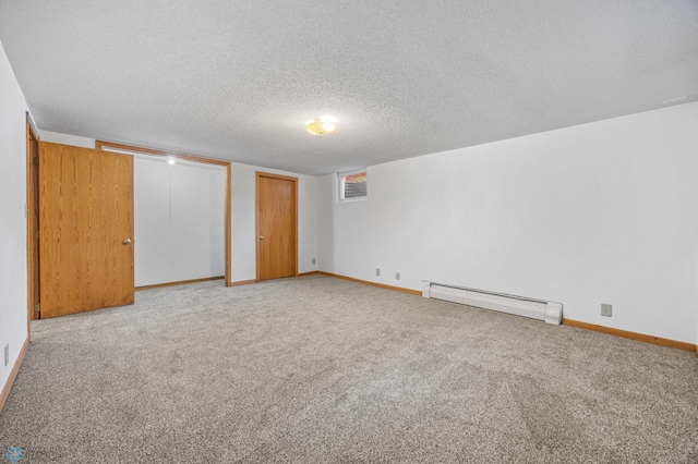 2319 10th St S, Fargo, ND 58103 - unfurnished room featuring a baseboard radiator, carpet, and a textured ceiling