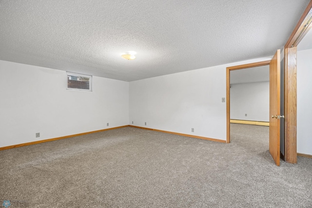 2319 10th St S, Fargo, ND 58103 - spare room featuring carpet flooring, baseboard heating, and a textured ceiling