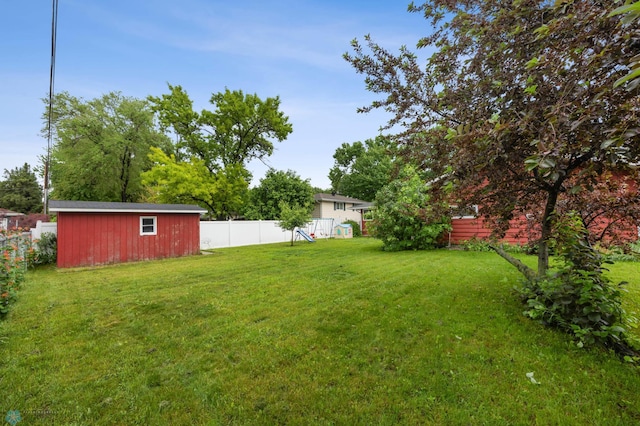 2319 10th St S, Fargo, ND 58103 - fenced backyard featuring a storage shed