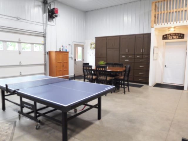 14650 Hilltop Rd, Ashby, MN 56309 - recreation room with healthy amount of natural light, finished concrete floors, and a high ceiling
