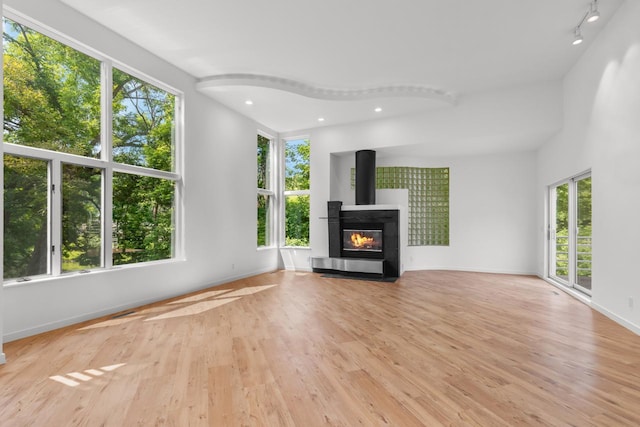 3520 Fairway Ln, Minnetonka, MN 55305 - unfurnished living room with plenty of natural light, light wood-style floors, and recessed lighting