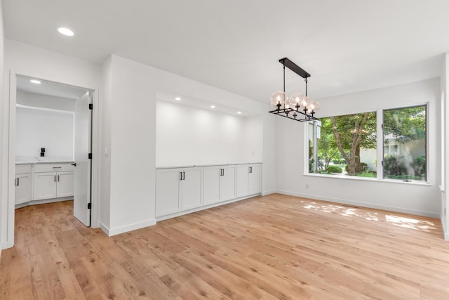 3520 Fairway Ln, Minnetonka, MN 55305 - unfurnished room featuring light wood finished floors, a chandelier, and recessed lighting