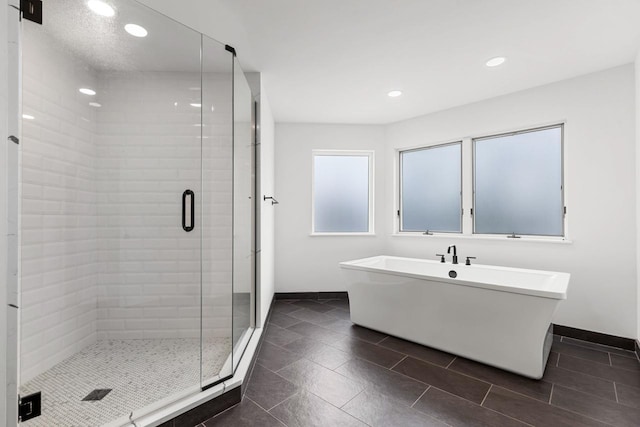 3520 Fairway Ln, Minnetonka, MN 55305 - full bathroom featuring a shower stall, a freestanding bath, recessed lighting, and tile patterned floors